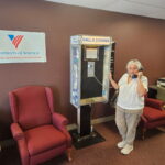 women using pay phone