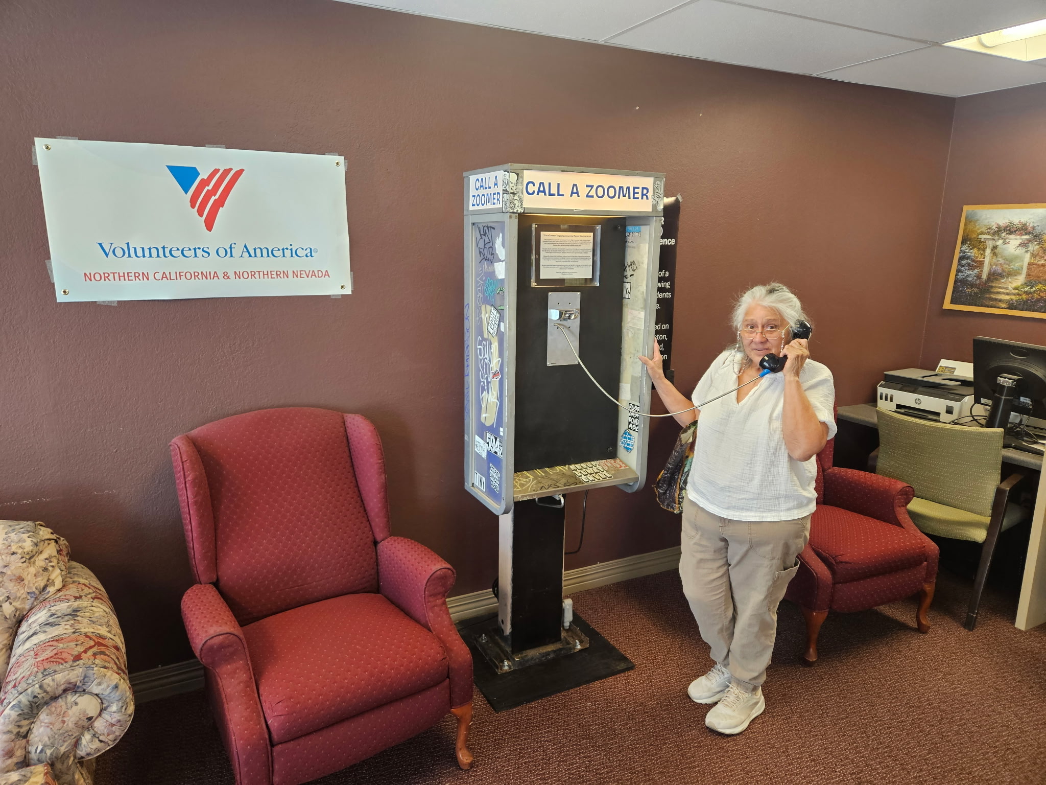 women using pay phone