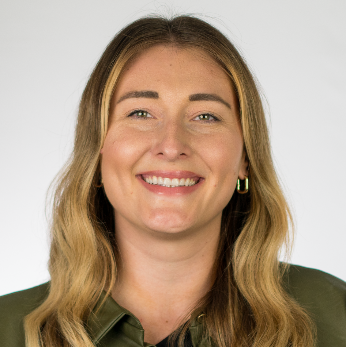Women in green jacket smiling